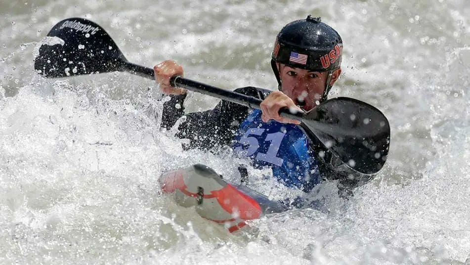 a man kayaking in rapids