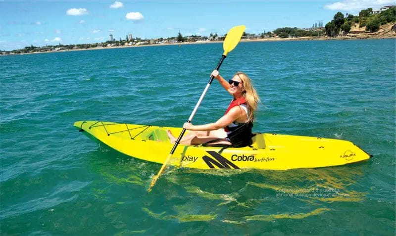 A woman in a yellow Cobra Kayak.