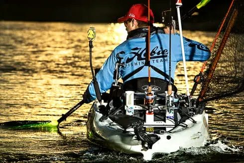 A man in a Hobie kayak.