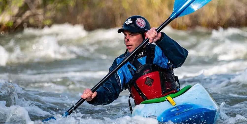 kayak wetsuit on rapids