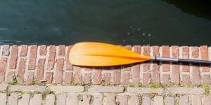 orange paddle on cement